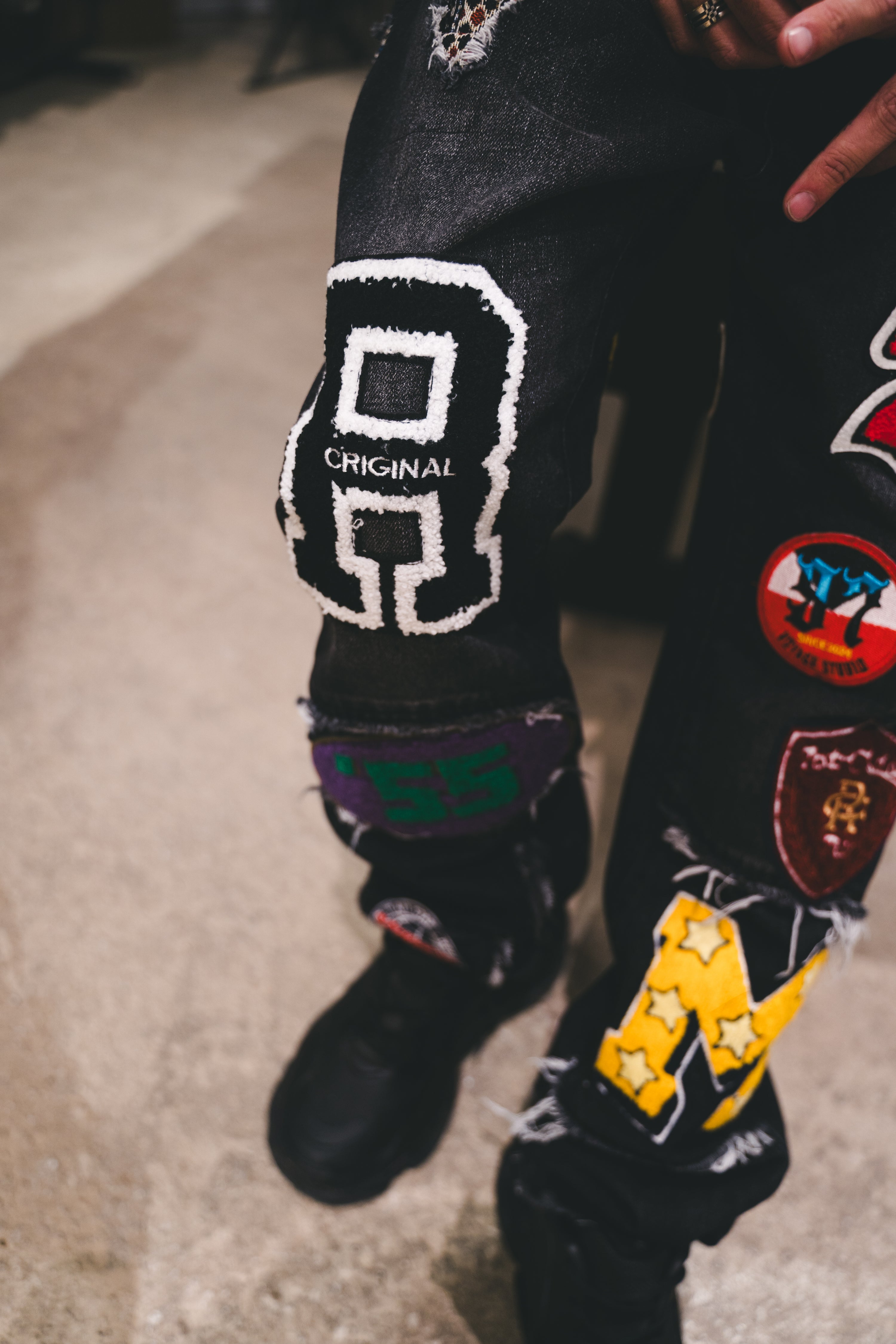 VOYAGE STUDIO VARSITY PATCHED JEANS