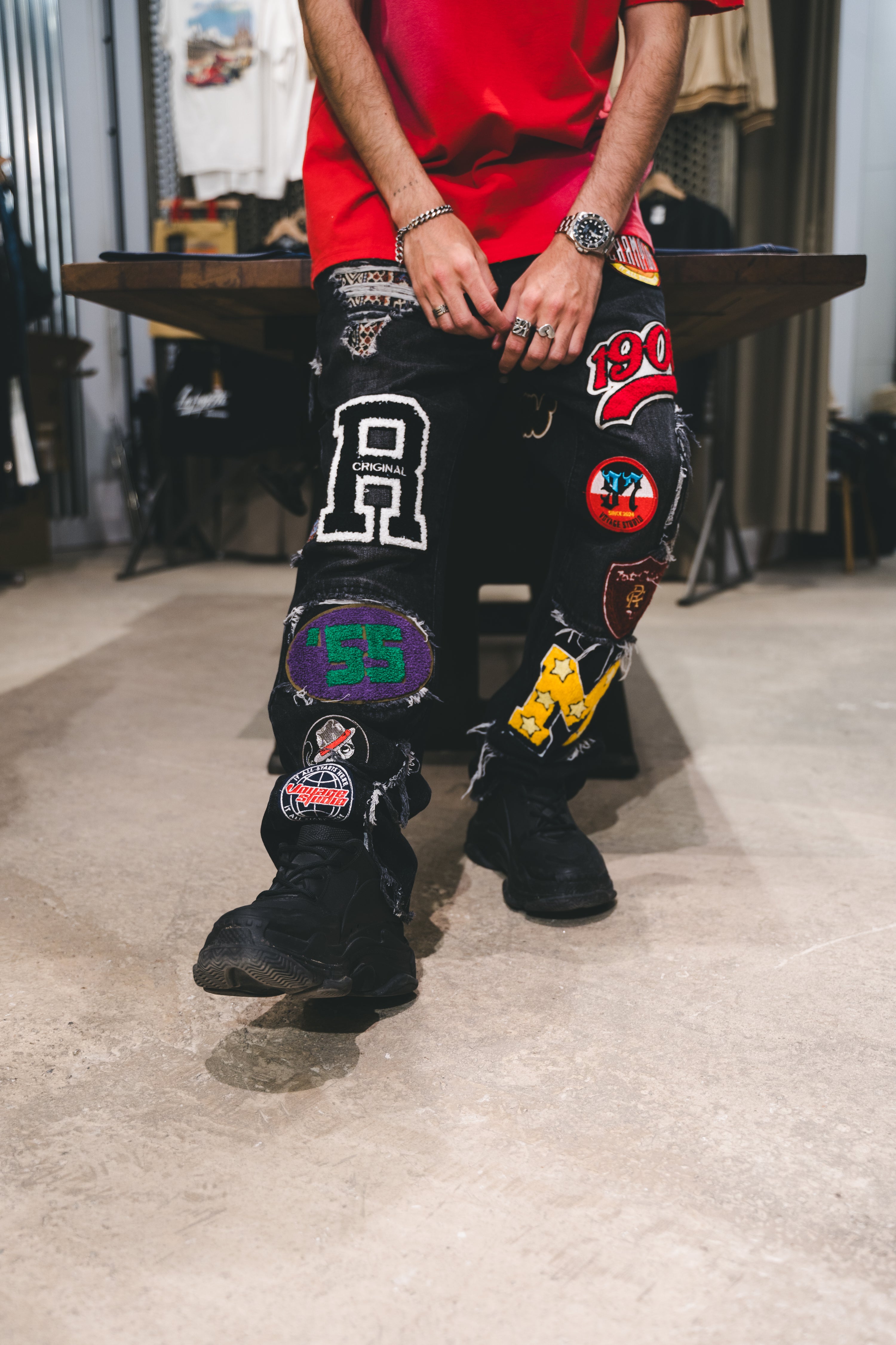 VOYAGE STUDIO VARSITY PATCHED JEANS