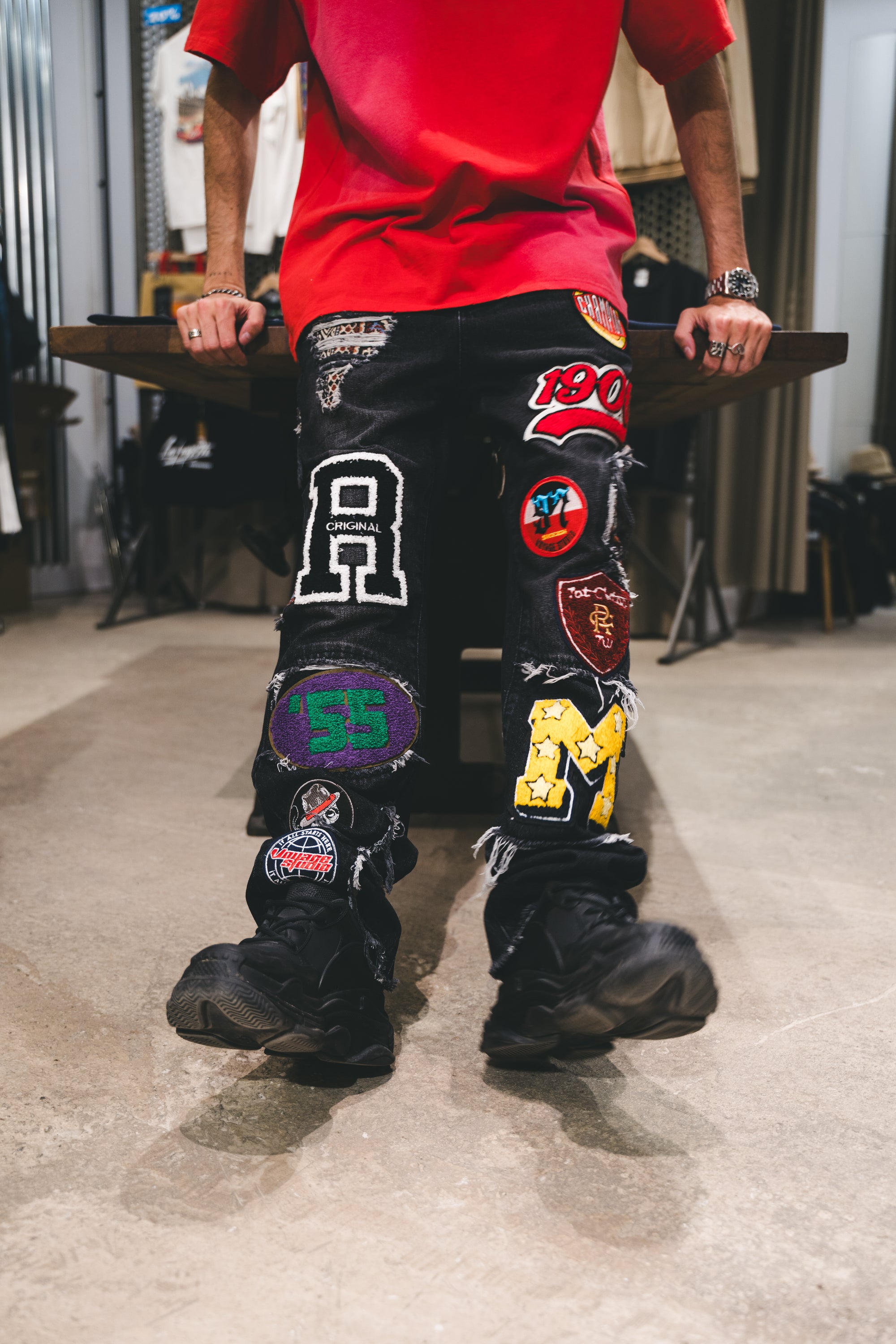 VOYAGE STUDIO VARSITY PATCHED JEANS